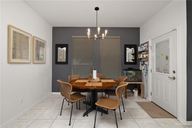 tiled dining room featuring a notable chandelier