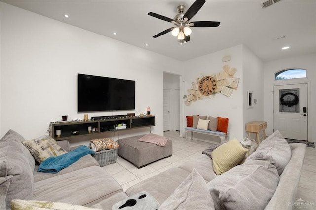 living room featuring ceiling fan and light tile patterned flooring