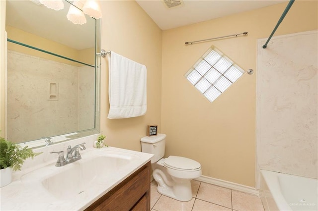 bathroom featuring tile patterned floors, vanity, and toilet