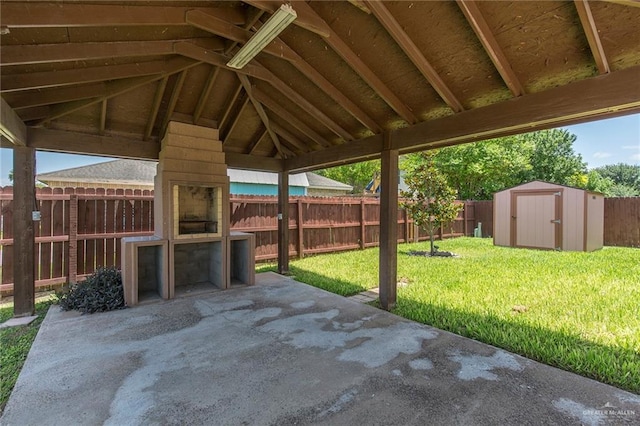 view of patio with a gazebo and a storage shed