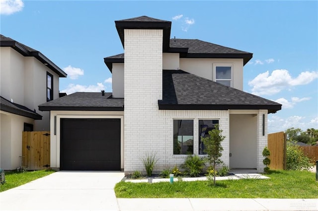 2508 E Solar Dr, Mission, TX 78501 - view of front of home with an attached garage, roof with shingles, concrete driveway, a chimney, and brick siding