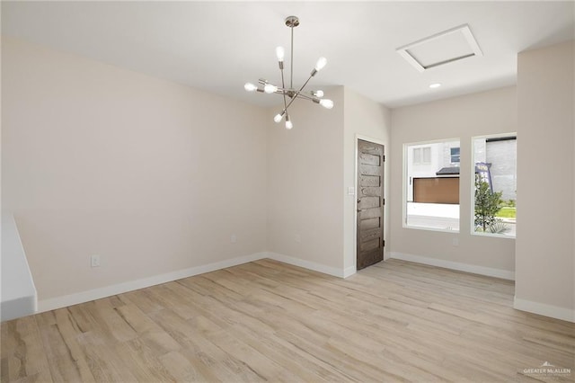 2508 E Solar Dr, Mission, TX 78501 - empty room with light wood finished floors, attic access, baseboards, a chandelier, and recessed lighting