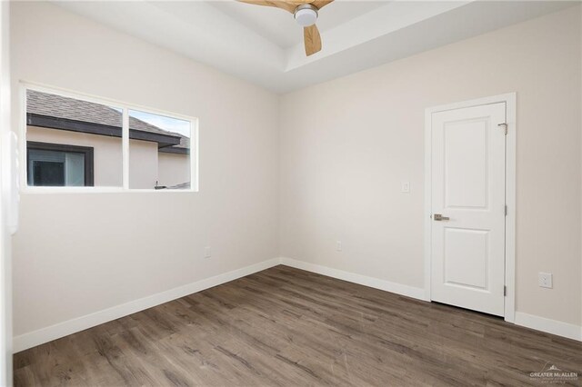 2508 E Solar Dr, Mission, TX 78501 - empty room with wood finished floors, baseboards, a ceiling fan, and a raised ceiling