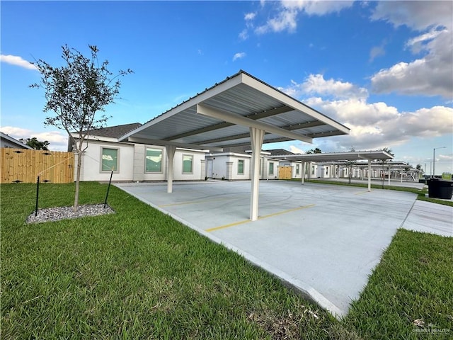 exterior space featuring a carport and a yard