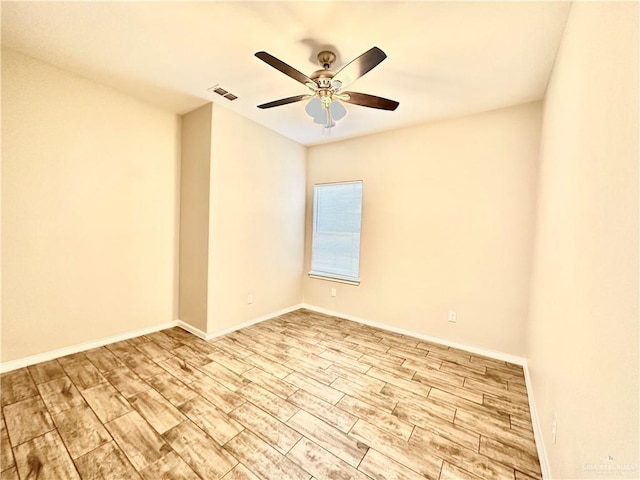 spare room with light hardwood / wood-style flooring and ceiling fan