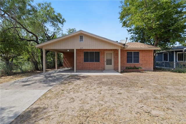 609 E Sprague St, Edinburg, TX 78539 - ranch-style house with brick siding, an attached carport, and driveway