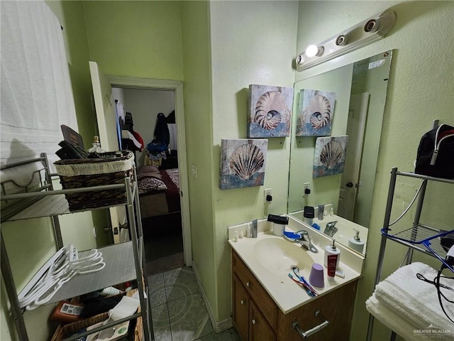 bathroom with tile patterned floors and vanity