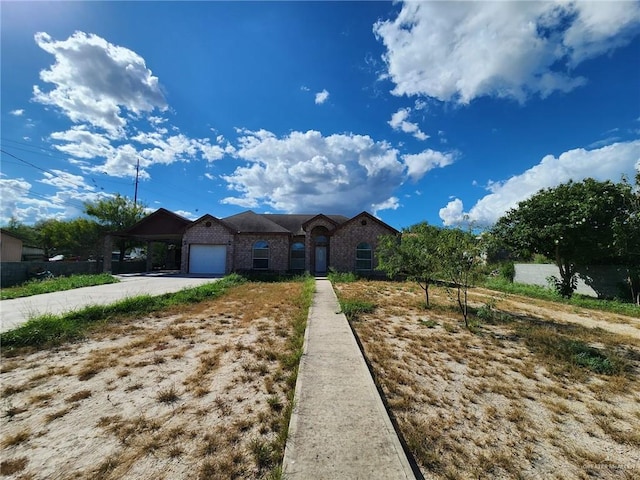 single story home featuring a garage