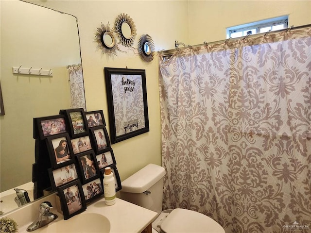 bathroom with vanity and toilet