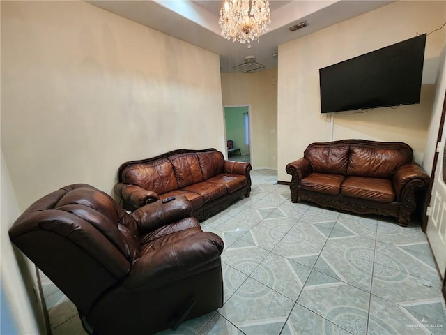 tiled living room with an inviting chandelier