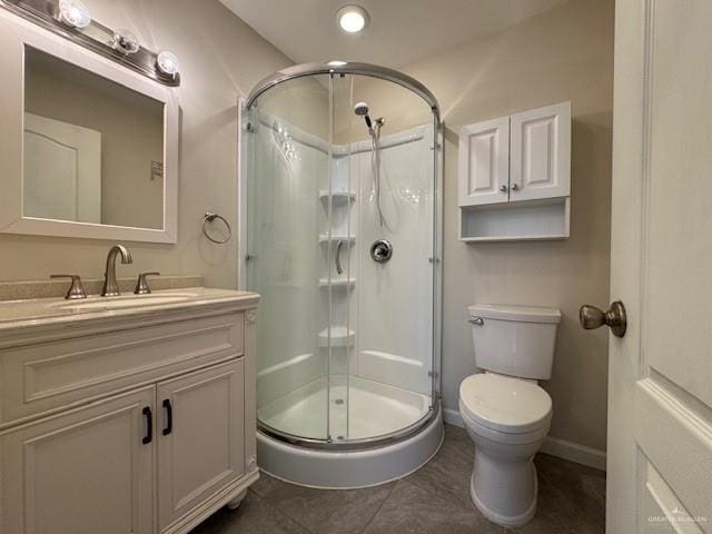 3810 Pelican Way, Mission, TX 78572 - bathroom with toilet, a stall shower, tile patterned flooring, baseboards, and vanity