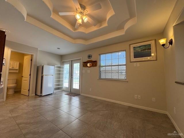 3810 Pelican Way, Mission, TX 78572 - empty room with baseboards, a raised ceiling, ceiling fan, and french doors