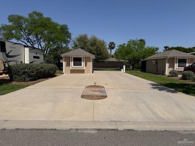 3810 Pelican Way, Mission, TX 78572 - view of front of home featuring an outdoor structure and stucco siding