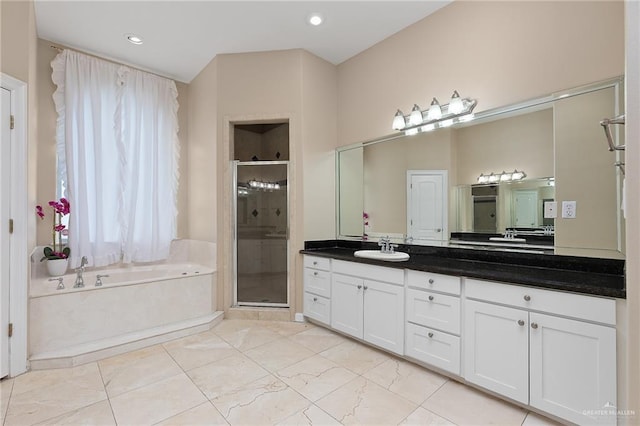 bathroom with shower with separate bathtub, vanity, and tile patterned floors