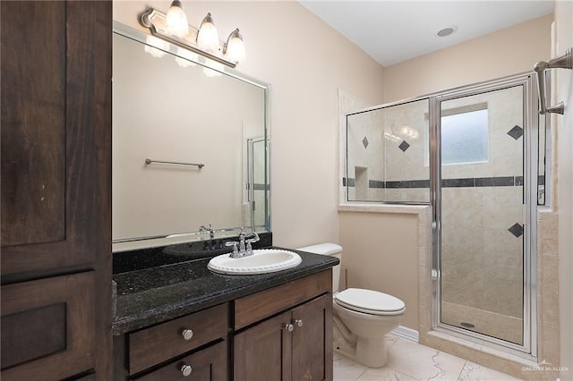 bathroom with vanity, an enclosed shower, and toilet