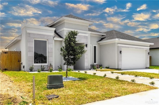 view of front facade featuring a garage, fence, roof with shingles, stucco siding, and a front lawn