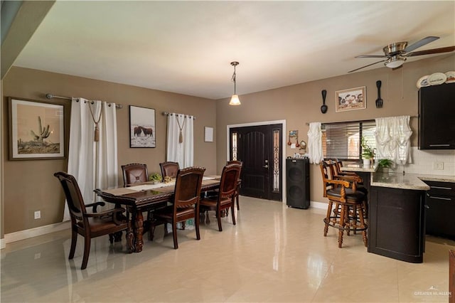 dining space with ceiling fan