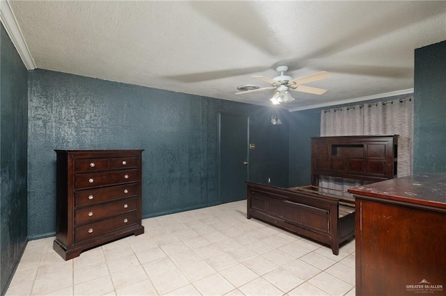 bedroom with a textured ceiling, ceiling fan, and ornamental molding