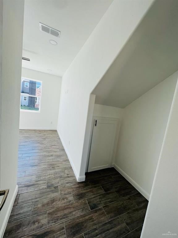 hallway with dark wood-type flooring