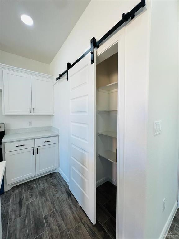 washroom featuring a barn door