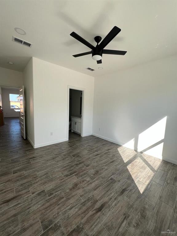 spare room with ceiling fan