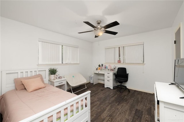 bedroom with dark hardwood / wood-style floors and ceiling fan