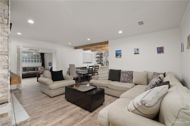 living room with ceiling fan, light hardwood / wood-style flooring, and ornamental molding