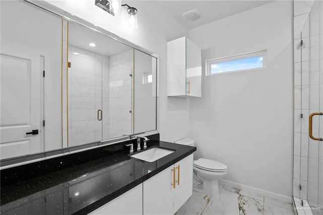 bathroom with vanity, toilet, and an enclosed shower