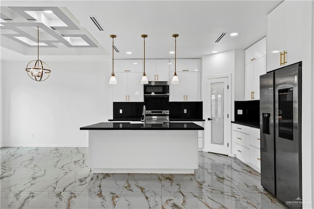 kitchen with white cabinets, backsplash, stainless steel appliances, and hanging light fixtures