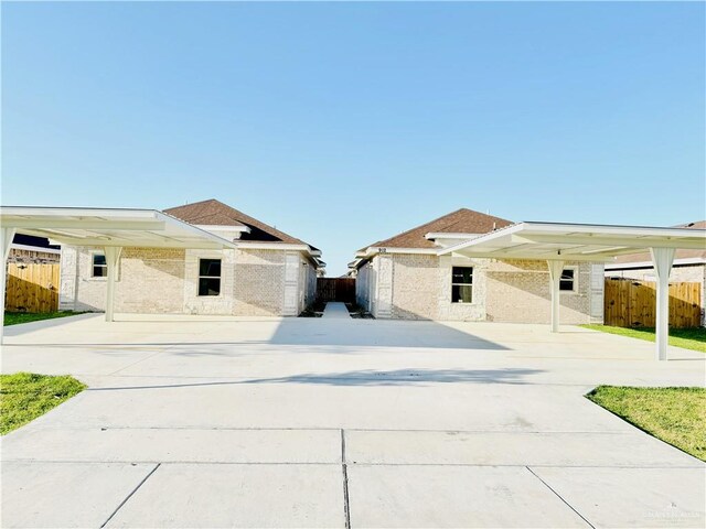 view of front of home featuring a carport