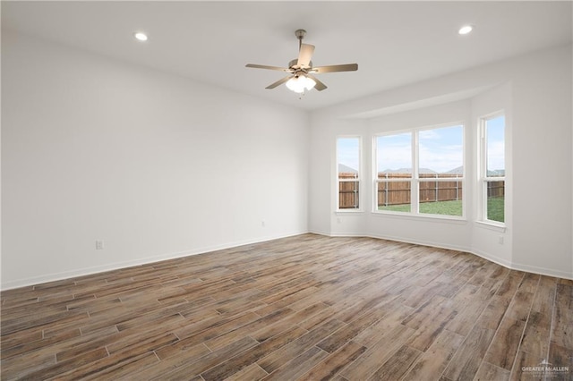 14724 Aqualina Way, Mcallen, TX 78504 - spare room featuring ceiling fan, wood finished floors, baseboards, and recessed lighting
