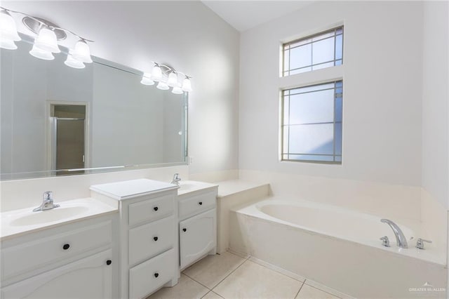 bathroom with tile patterned floors, vanity, and independent shower and bath