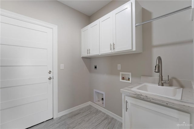 clothes washing area featuring washer hookup, sink, cabinets, and hookup for an electric dryer