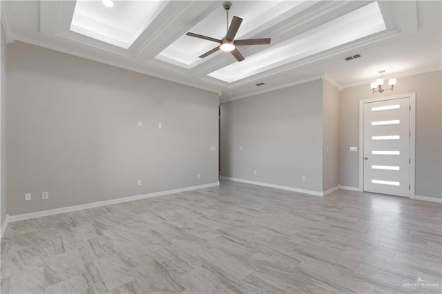 spare room with beam ceiling, coffered ceiling, ceiling fan with notable chandelier, and ornamental molding