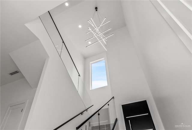 details with visible vents and an inviting chandelier