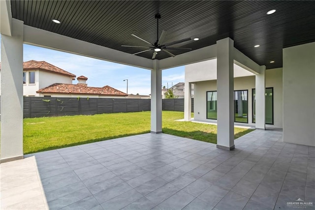 view of patio / terrace with fence and ceiling fan
