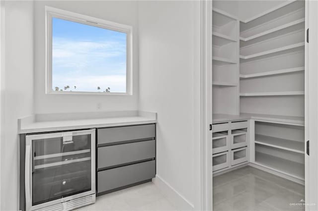 walk in closet with beverage cooler