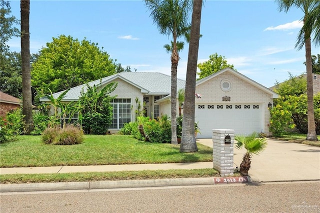 ranch-style house with a front yard and a garage