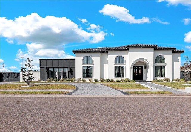 mediterranean / spanish home with french doors