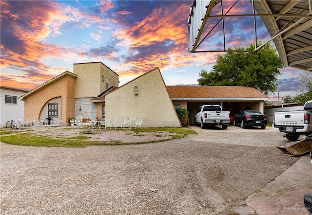 view of property exterior at dusk