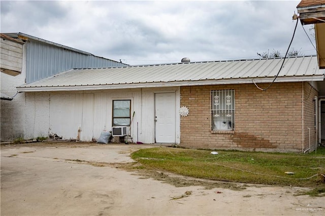 back of house featuring cooling unit