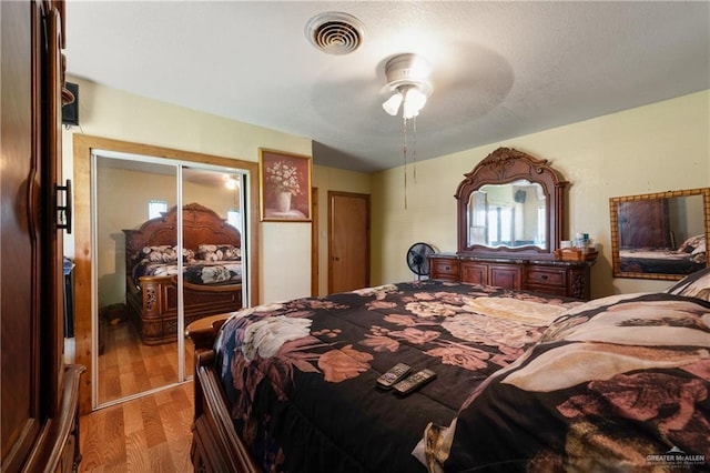 15668 Primera Rd, Harlingen, TX 78552 - bedroom with wood finished floors, ceiling fan, and a closet