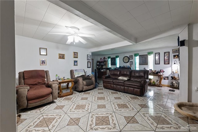 15668 Primera Rd, Harlingen, TX 78552 - living area with light tile patterned floors, a ceiling fan, and beamed ceiling