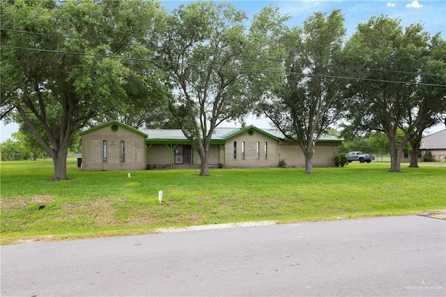 15668 Primera Rd, Harlingen, TX 78552 - ranch-style home with a front yard