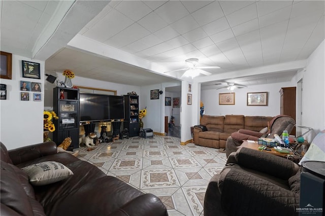15668 Primera Rd, Harlingen, TX 78552 - living room featuring ceiling fan, light tile patterned flooring, and beam ceiling