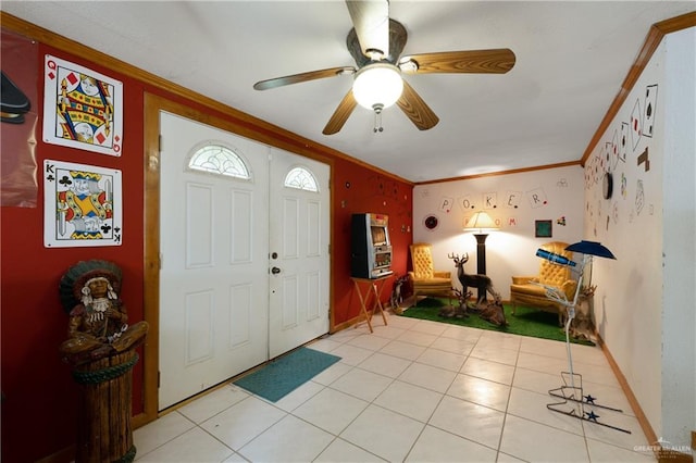 15668 Primera Rd, Harlingen, TX 78552 - foyer entrance with crown molding, ceiling fan, baseboards, and light tile patterned floors