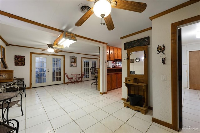 15668 Primera Rd, Harlingen, TX 78552 - living area with french doors, a ceiling fan, crown molding, light tile patterned flooring, and baseboards