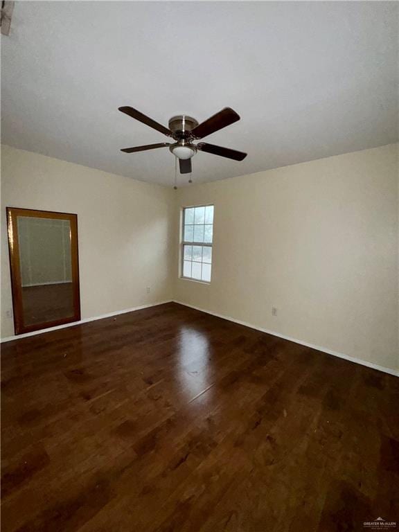 unfurnished room featuring dark hardwood / wood-style floors and ceiling fan