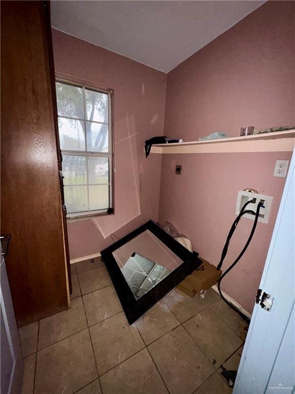 bathroom with tile patterned floors