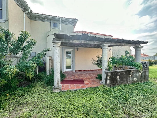 4132 Cosentino Dr, Mcallen, TX 78504 - back of house with stucco siding, a pergola, a patio area, and a lawn